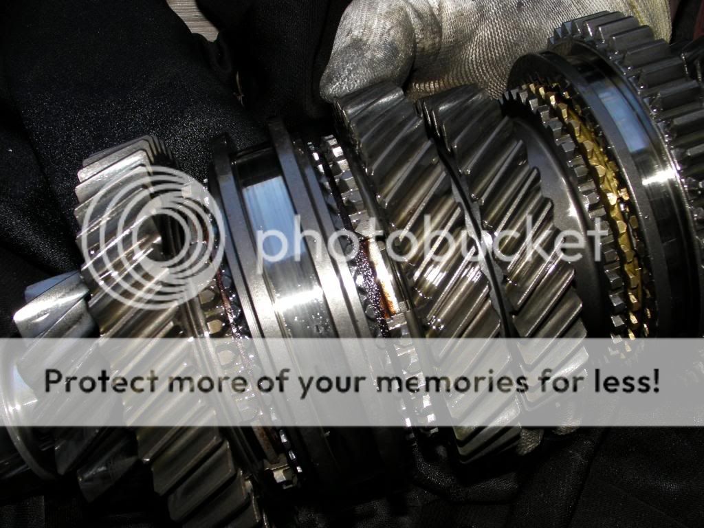 5 speed stuck in gear. Hit starter, car moves forward or synchros grind.